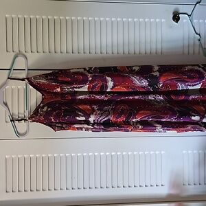 Full length dress with spaghetti straps. The overlay is sheer but lined.